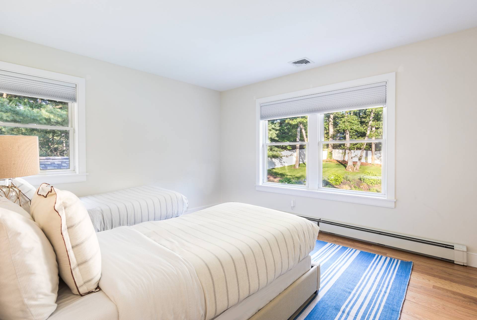 27 Kings Point Road East Hampton, NY 11937 - Photo 12 of 17 a bedroom with two beds and a large window