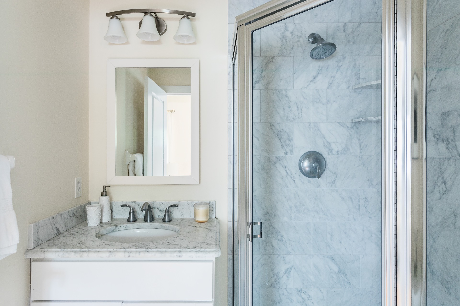 27 Kings Point Road East Hampton, NY 11937 - Photo 14 of 17 a bathroom with a granite countertop shower sink and mirror
