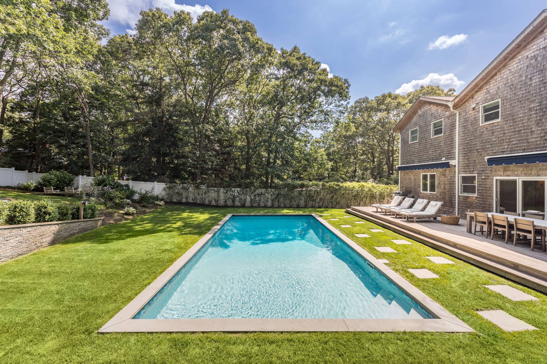 27 Kings Point Road East Hampton, NY 11937 - Photo 15 of 17 swimming pool with chairs