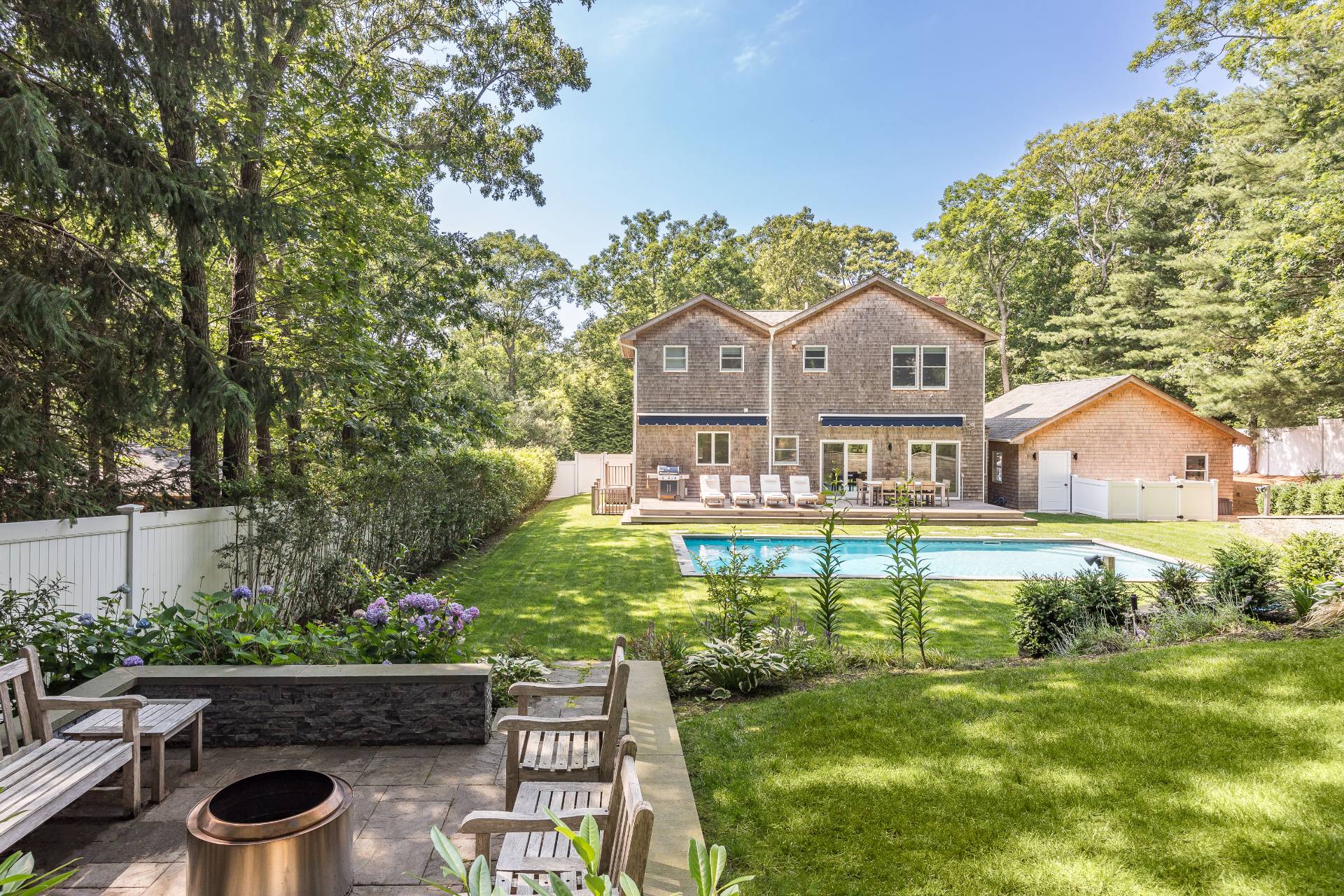 27 Kings Point Road East Hampton, NY 11937 - Photo 16 of 17 a front view of a house with a yard