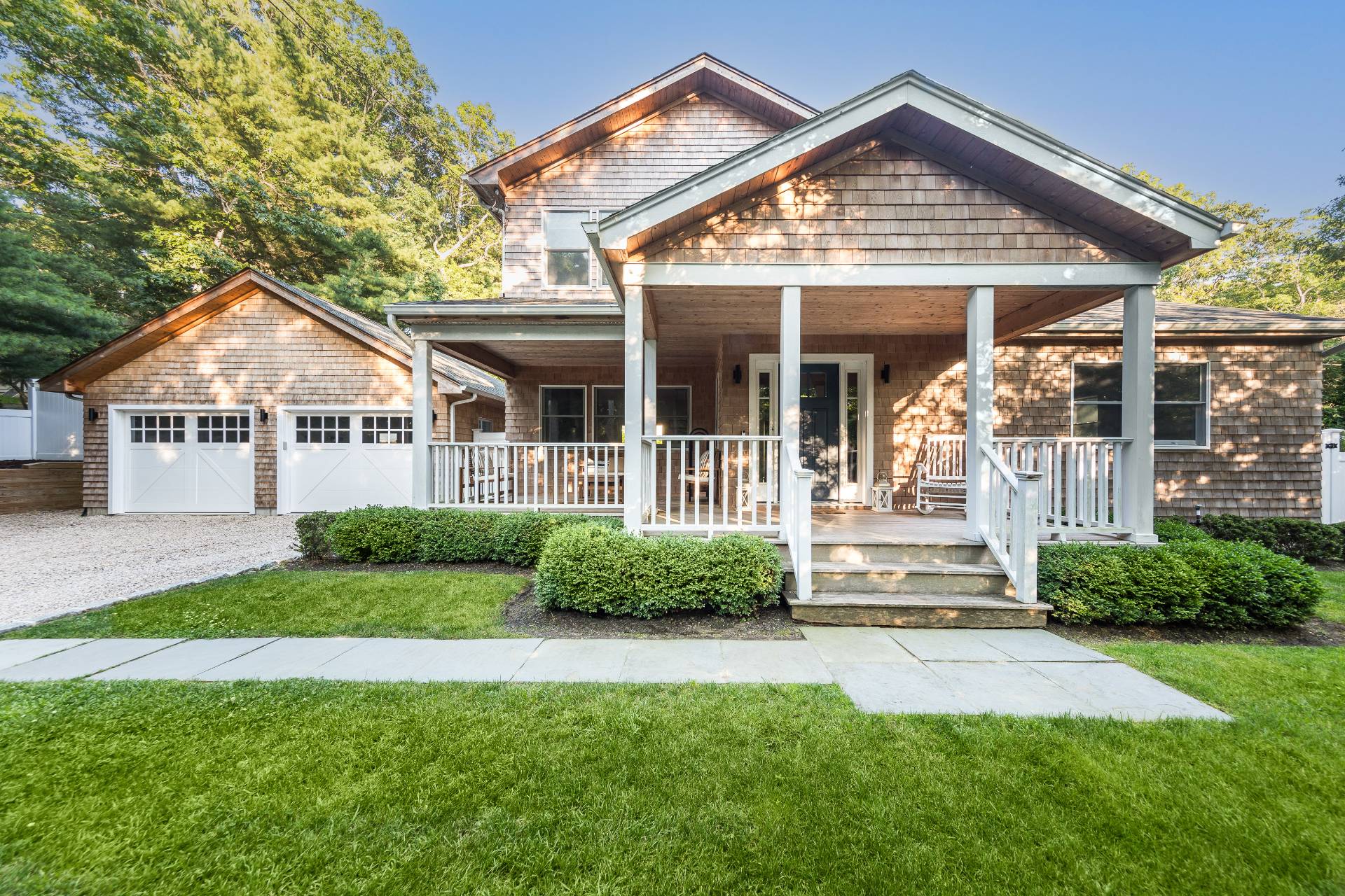 27 Kings Point Road East Hampton, NY 11937 - Photo 2 of 17 a front view of a house with a yard