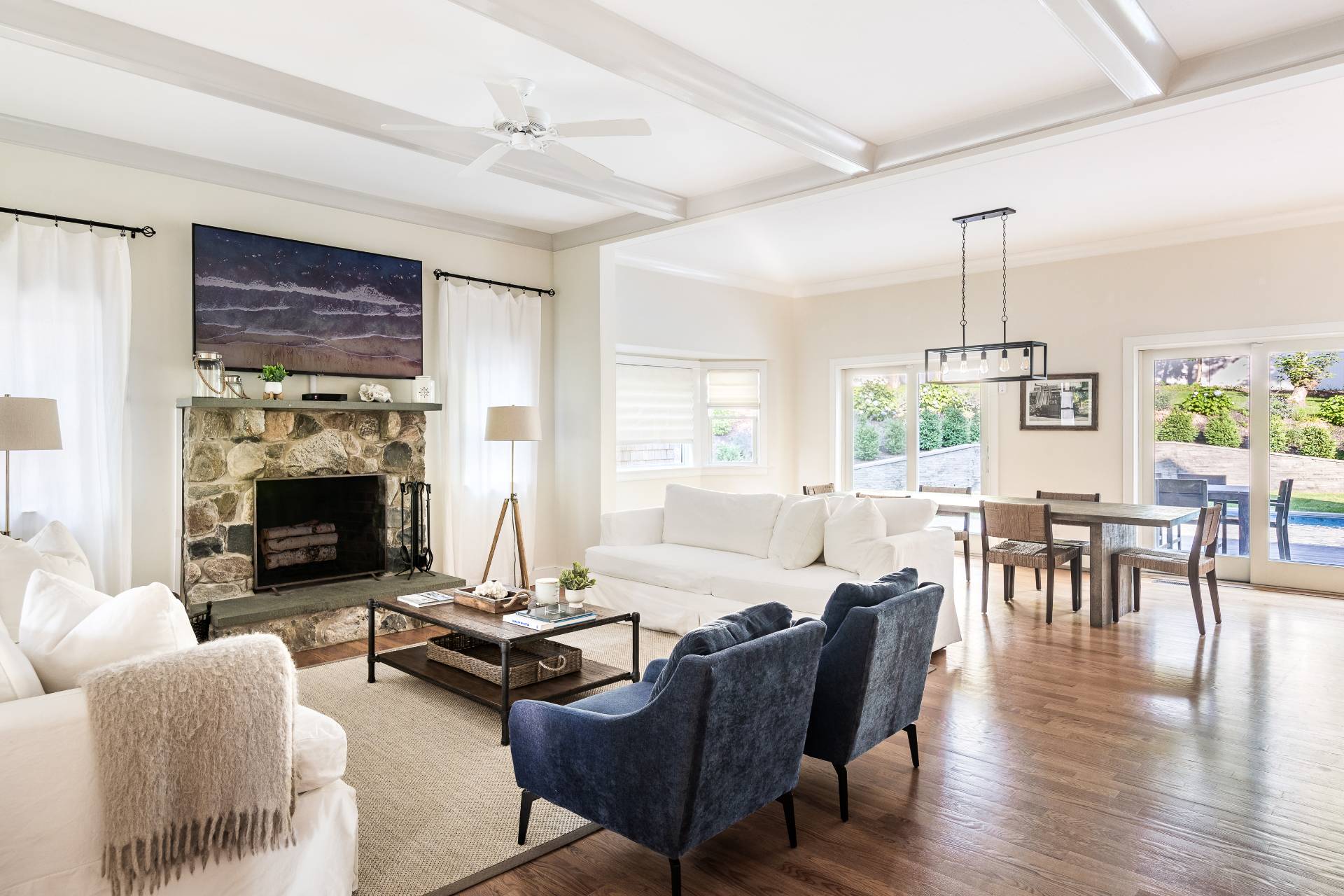27 Kings Point Road East Hampton, NY 11937 - Photo 3 of 17 a living room with furniture a fireplace and a dining table with wooden floor