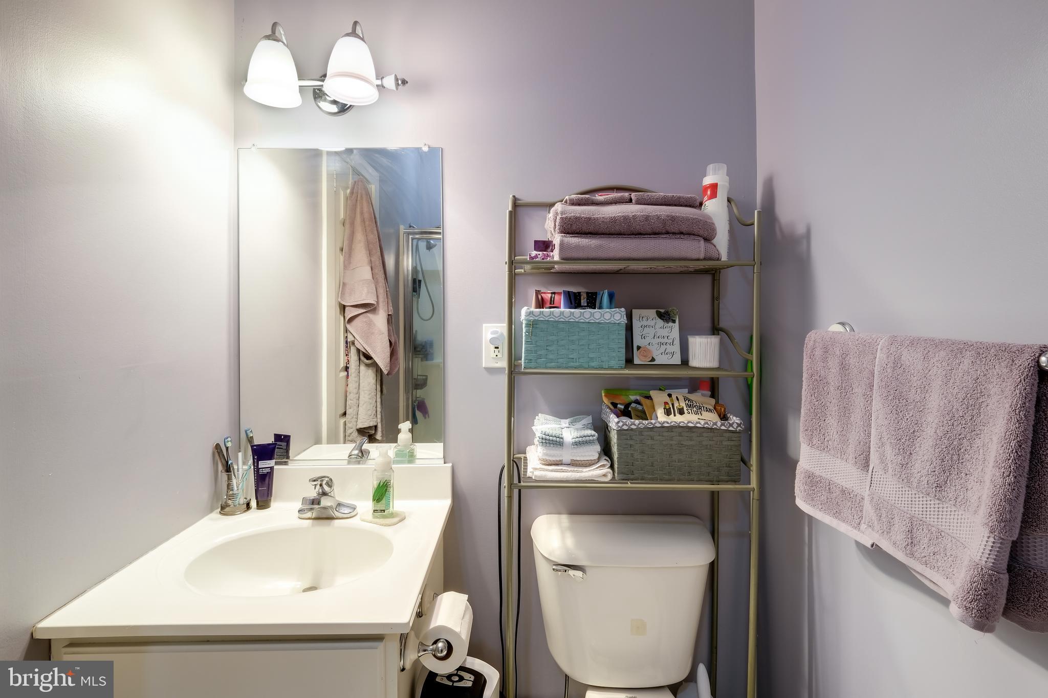 22 North Main Street, Unit 1 Doylestown, PA 18901 - Photo 15 of 22 a bathroom with a sink toilet and shower