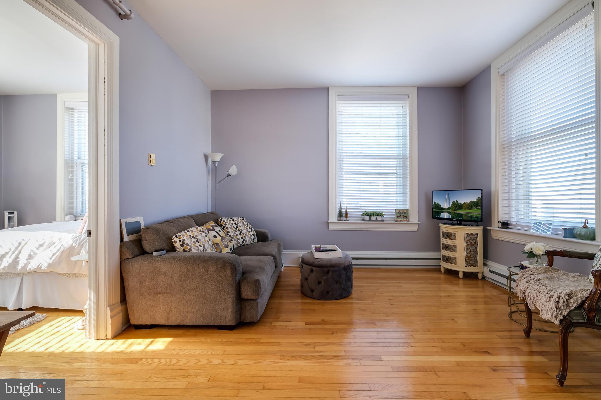 22 North Main Street, Unit 1 Doylestown, PA 18901 - Photo 18 of 22 a living room with furniture window and a table