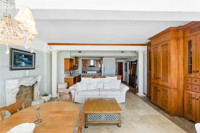 a living room with furniture a window and a flat screen tv