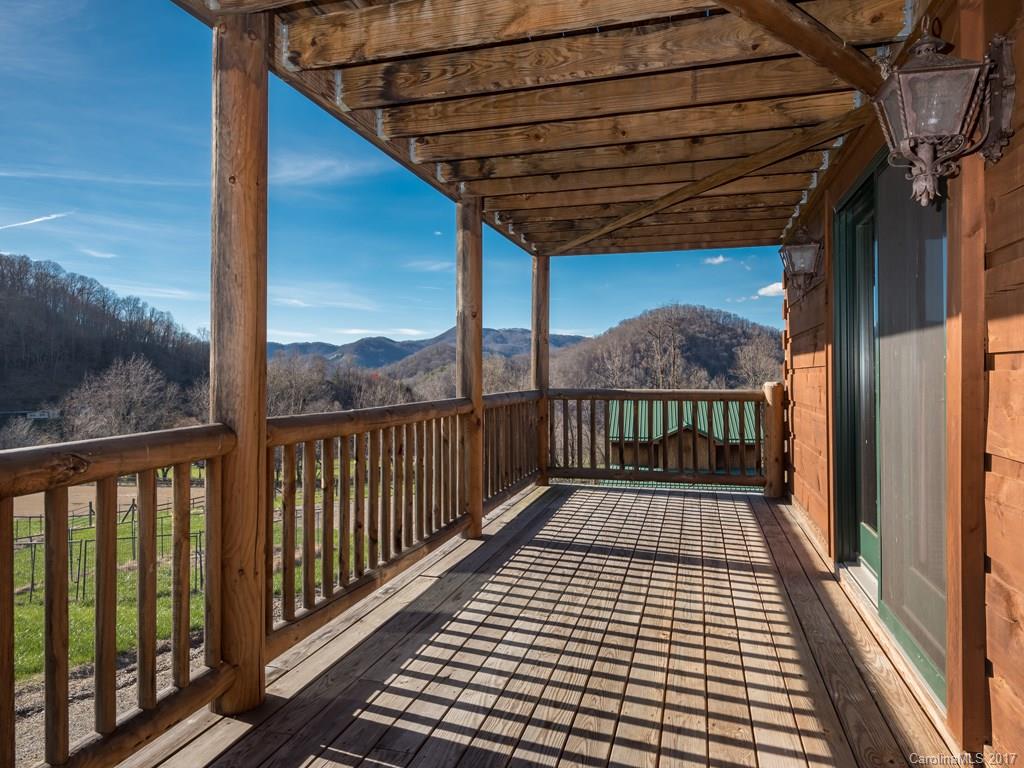 755 Poplar Cove Road Clyde, NC 28721 - Photo 2 of 24 a view of a balcony with wooden floor