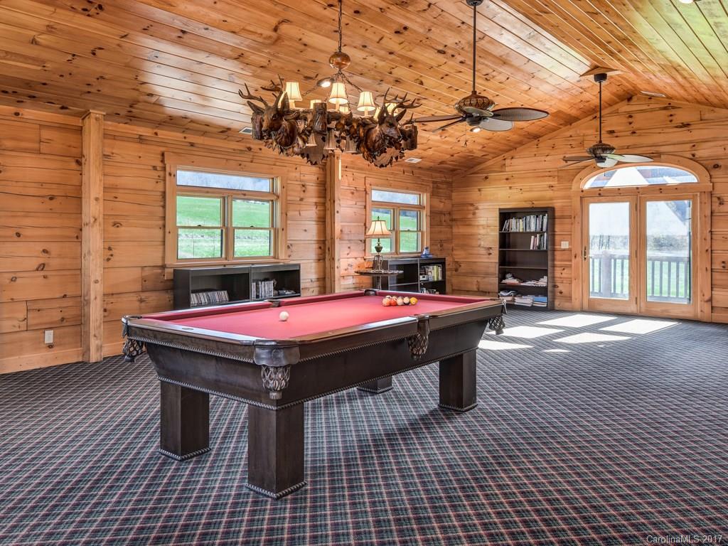 755 Poplar Cove Road Clyde, NC 28721 - Photo 12 of 24 a outdoor space with pool table and chairs