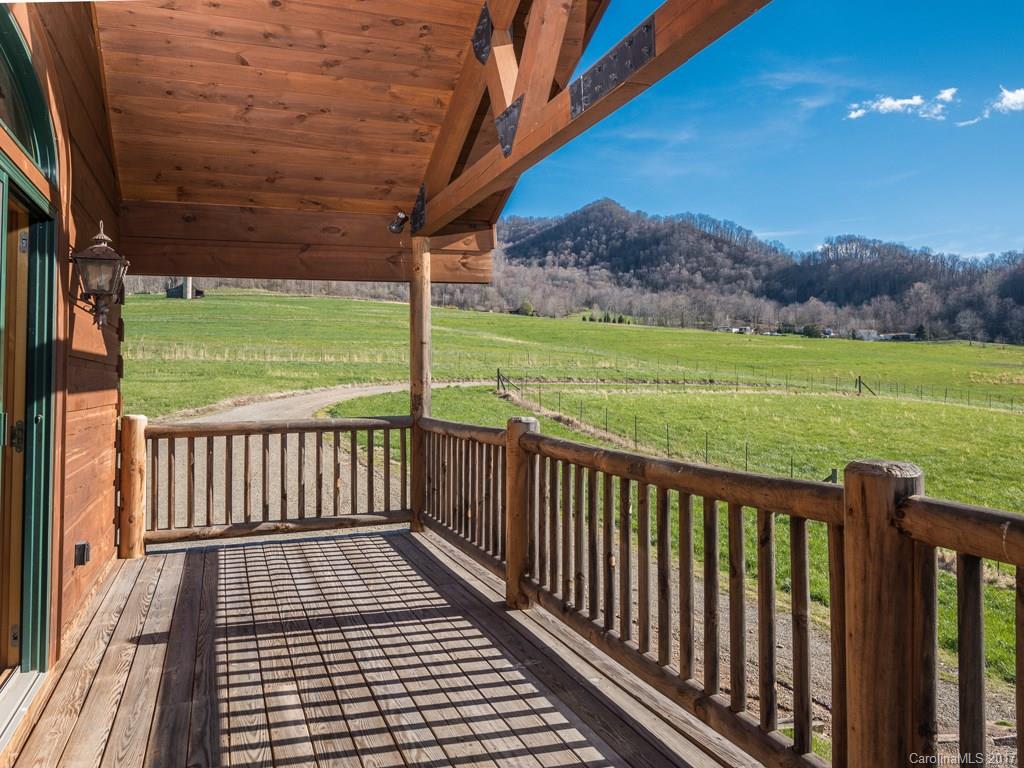 755 Poplar Cove Road Clyde, NC 28721 - Photo 15 of 24 a view of a deck with a yard