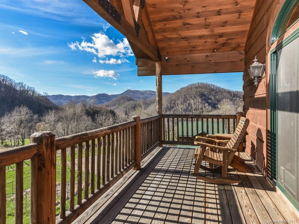 755 Poplar Cove Road Clyde, NC 28721 - Photo 16 of 24 a view of a balcony with wooden floor