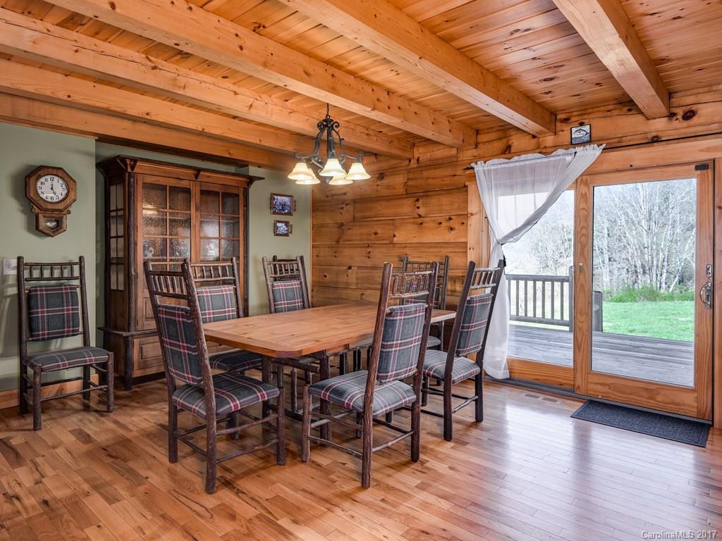 755 Poplar Cove Road Clyde, NC 28721 - Photo 7 of 24 a view of a dinning table and chairs in the patio
