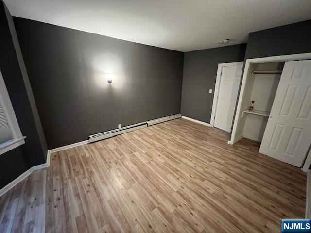 108 Chester Avenue Newark, NJ 07104 - Photo 4 of 7 a view of empty room with wooden floor