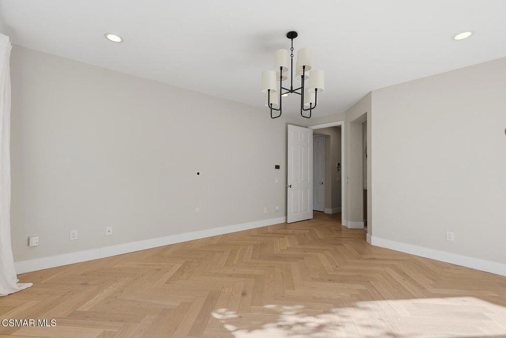4630 Rio Bravo Court Moorpark, CA 93021 - Photo 18 of 43 a view of a hallway with a chandelier