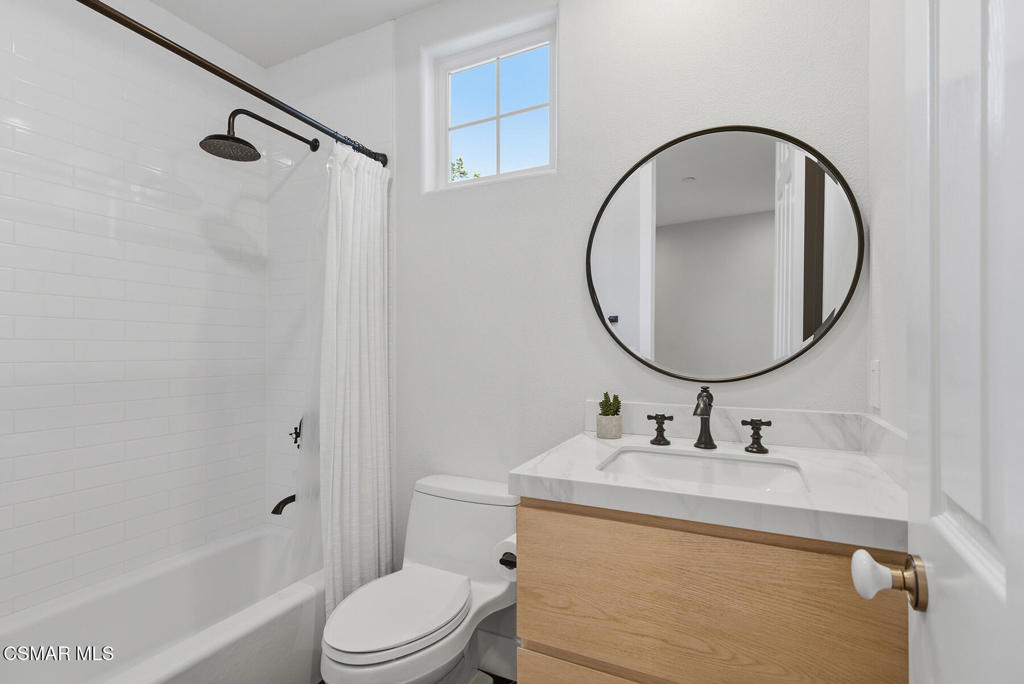 4630 Rio Bravo Court Moorpark, CA 93021 - Photo 26 of 43 a bathroom with a sink a toilet and a mirror