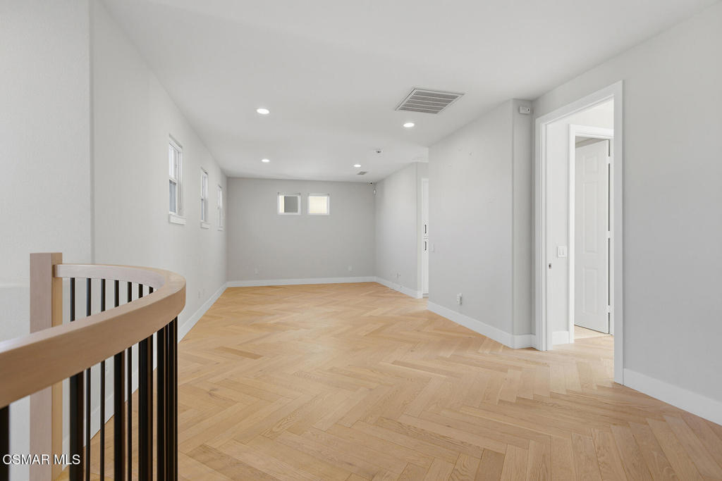 4630 Rio Bravo Court Moorpark, CA 93021 - Photo 28 of 43 a view of an empty room with wooden floor and a window