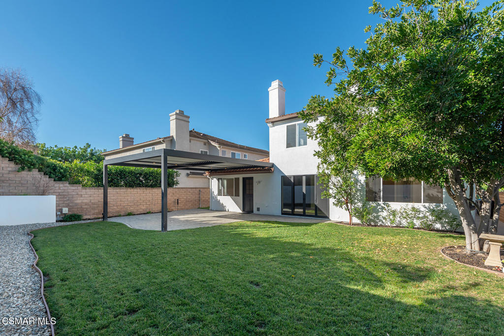 4630 Rio Bravo Court Moorpark, CA 93021 - Photo 37 of 43 a view of a house with a yard and sitting area
