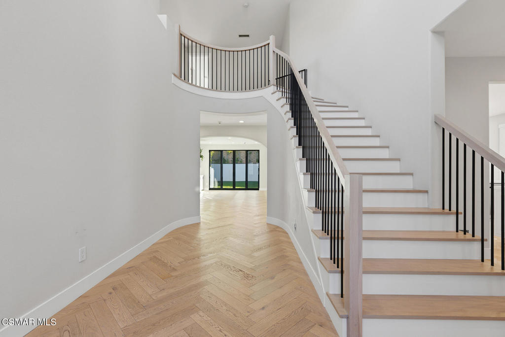 4630 Rio Bravo Court Moorpark, CA 93021 - Photo 4 of 43 a view of staircase with wooden floor and a potted plant
