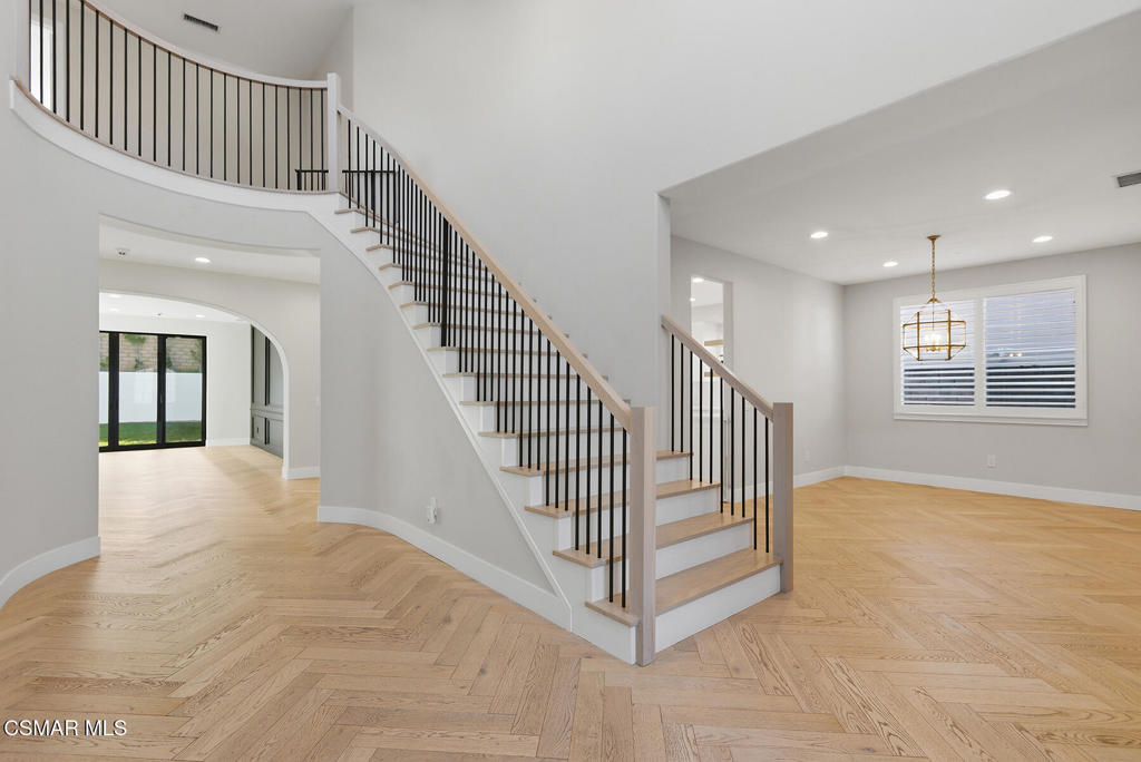 4630 Rio Bravo Court Moorpark, CA 93021 - Photo 5 of 43 a view of staircase with white walls and a window