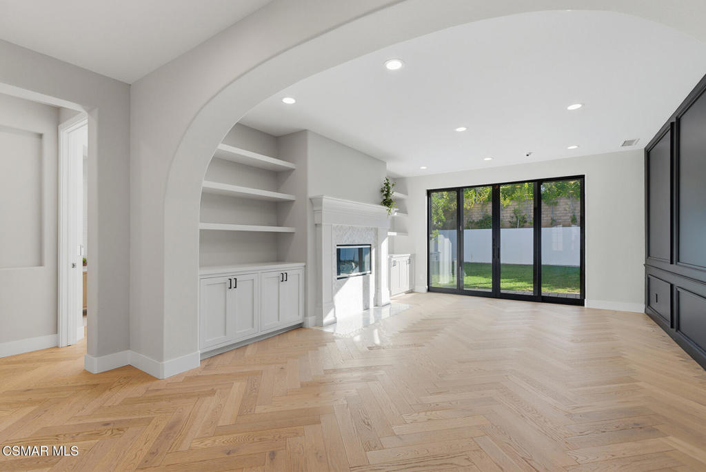 4630 Rio Bravo Court Moorpark, CA 93021 - Photo 7 of 43 an empty room with a fireplace and large window