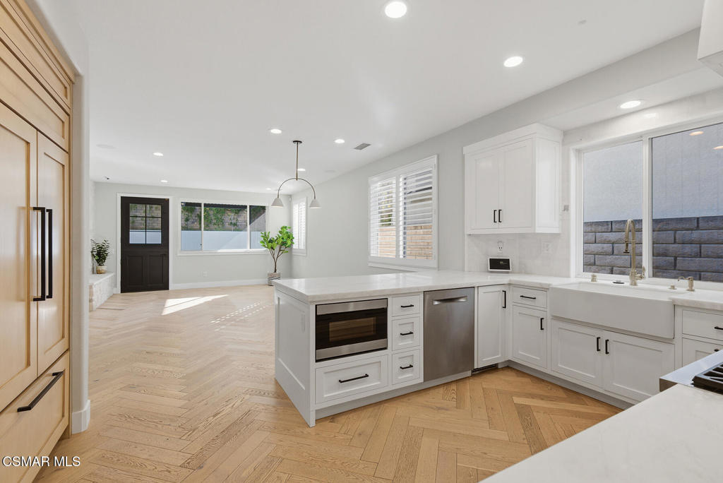 4630 Rio Bravo Court Moorpark, CA 93021 - Photo 10 of 43 a large kitchen with stainless steel appliances granite countertop a stove and a sink