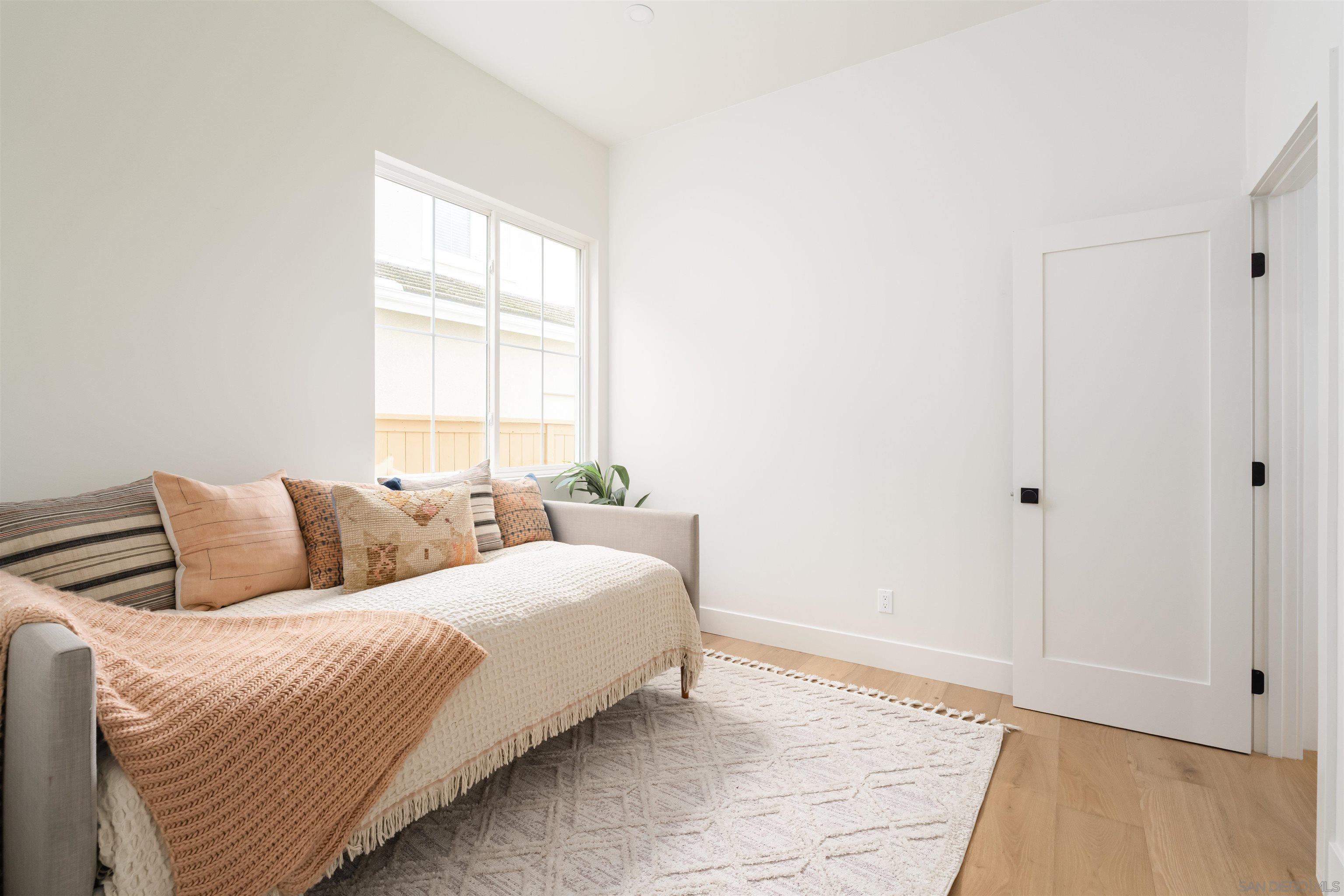 5077 Ashberry Road Carlsbad, CA 92008 - Photo 17 of 35 a bedroom with a bed and a window