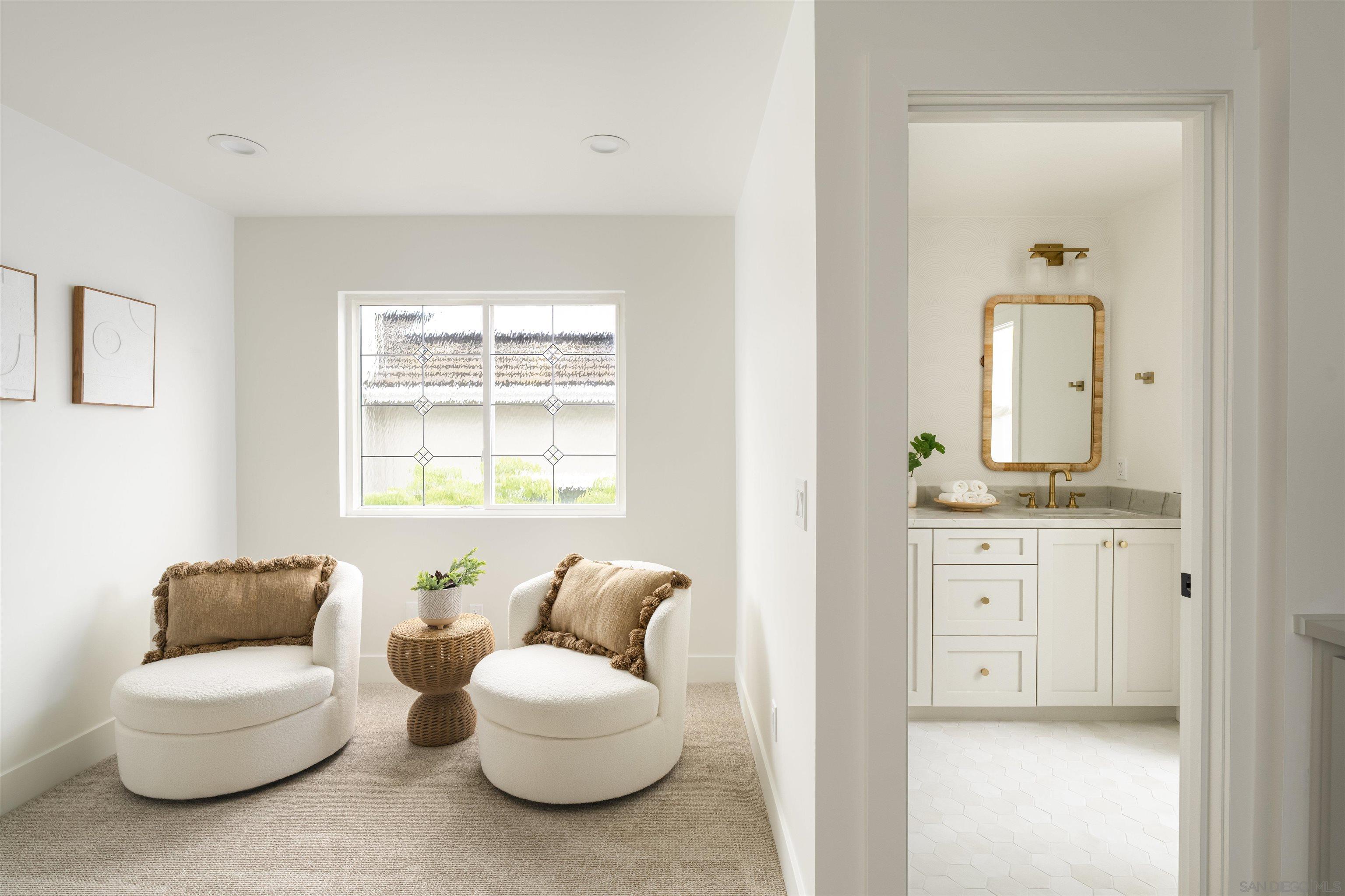 5077 Ashberry Road Carlsbad, CA 92008 - Photo 21 of 35 a living room with furniture a window and a mirror