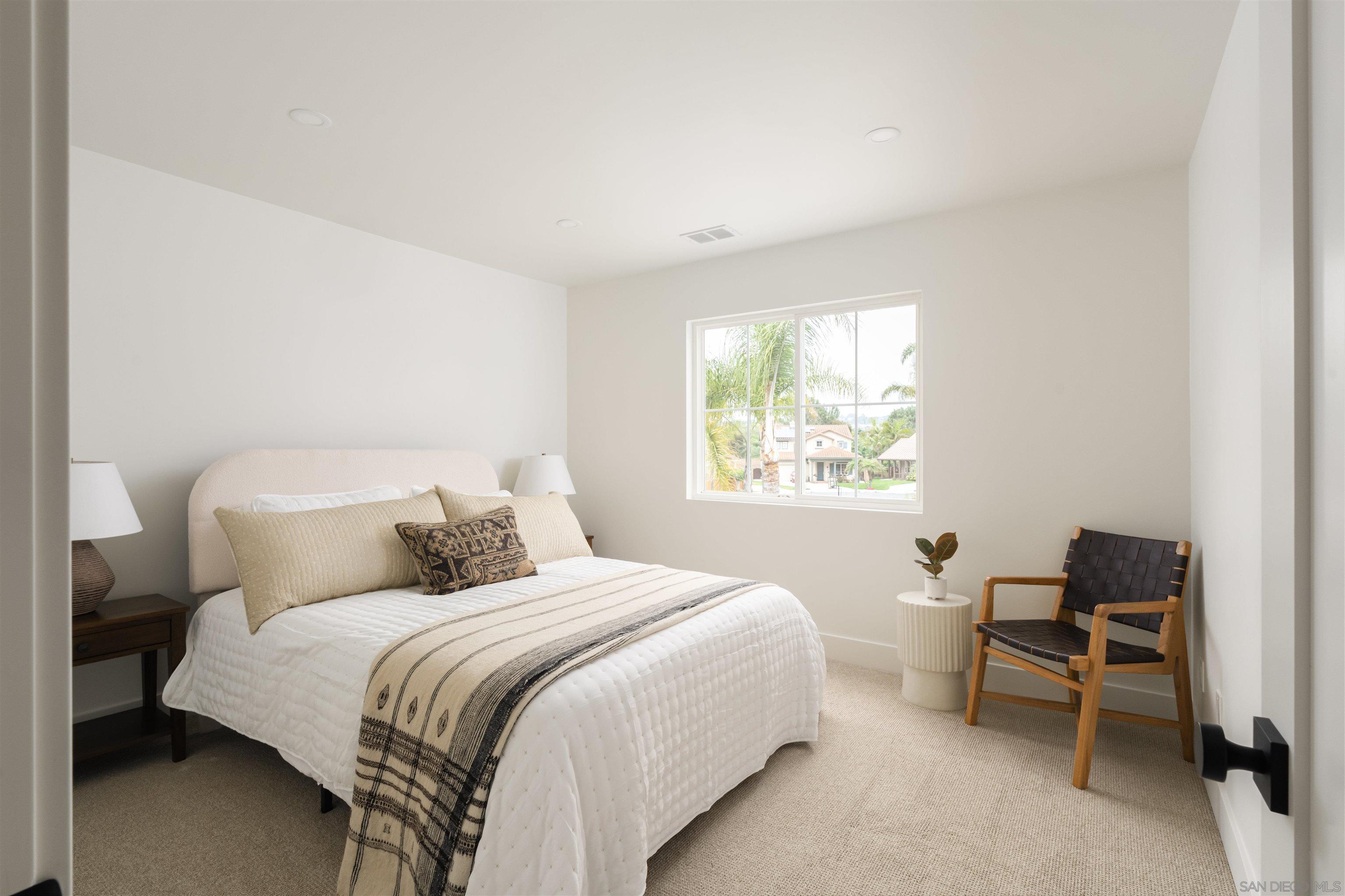 5077 Ashberry Road Carlsbad, CA 92008 - Photo 23 of 35 a bedroom with a bed and a window