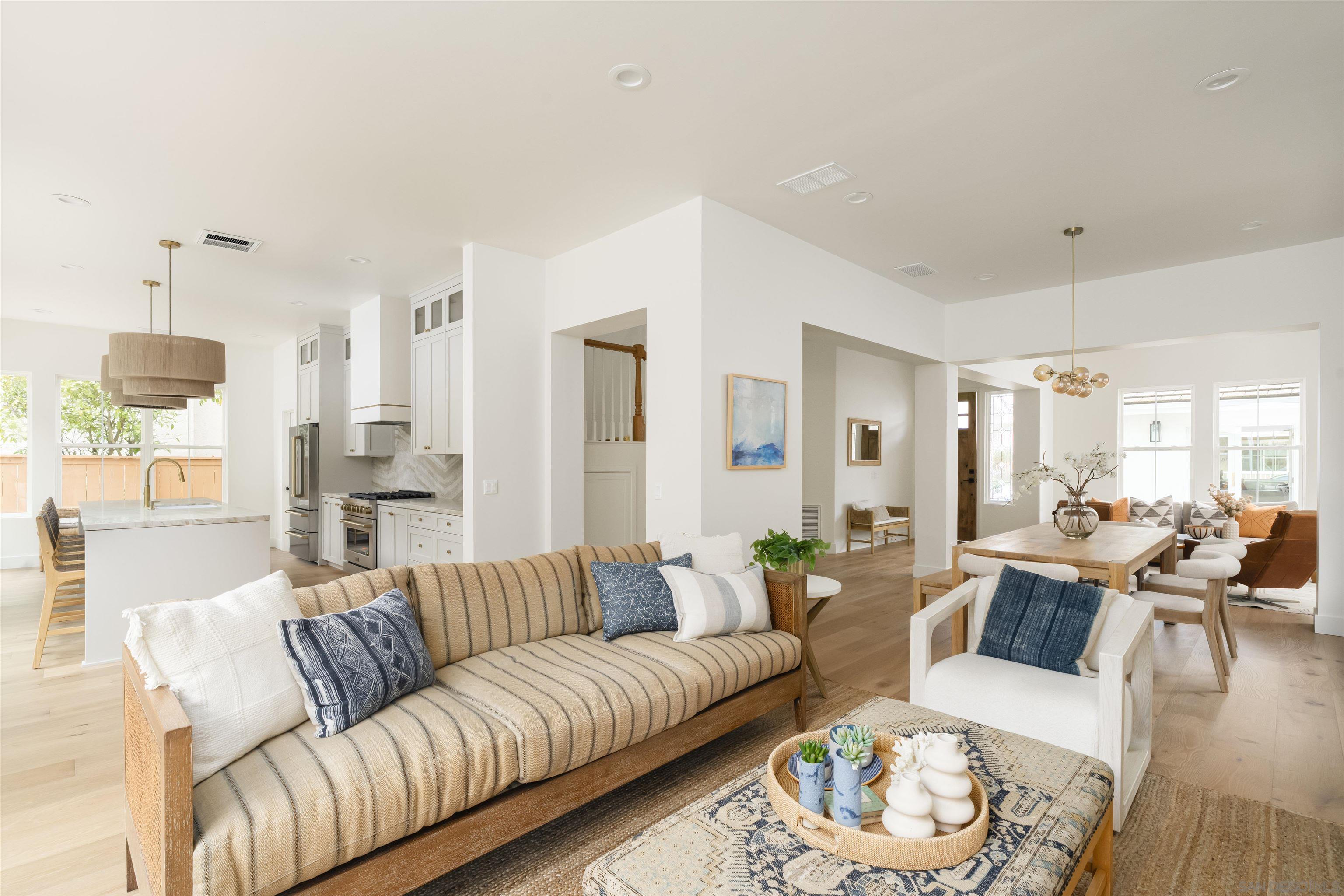 5077 Ashberry Road Carlsbad, CA 92008 - Photo 9 of 35 a living room with furniture and a chandelier