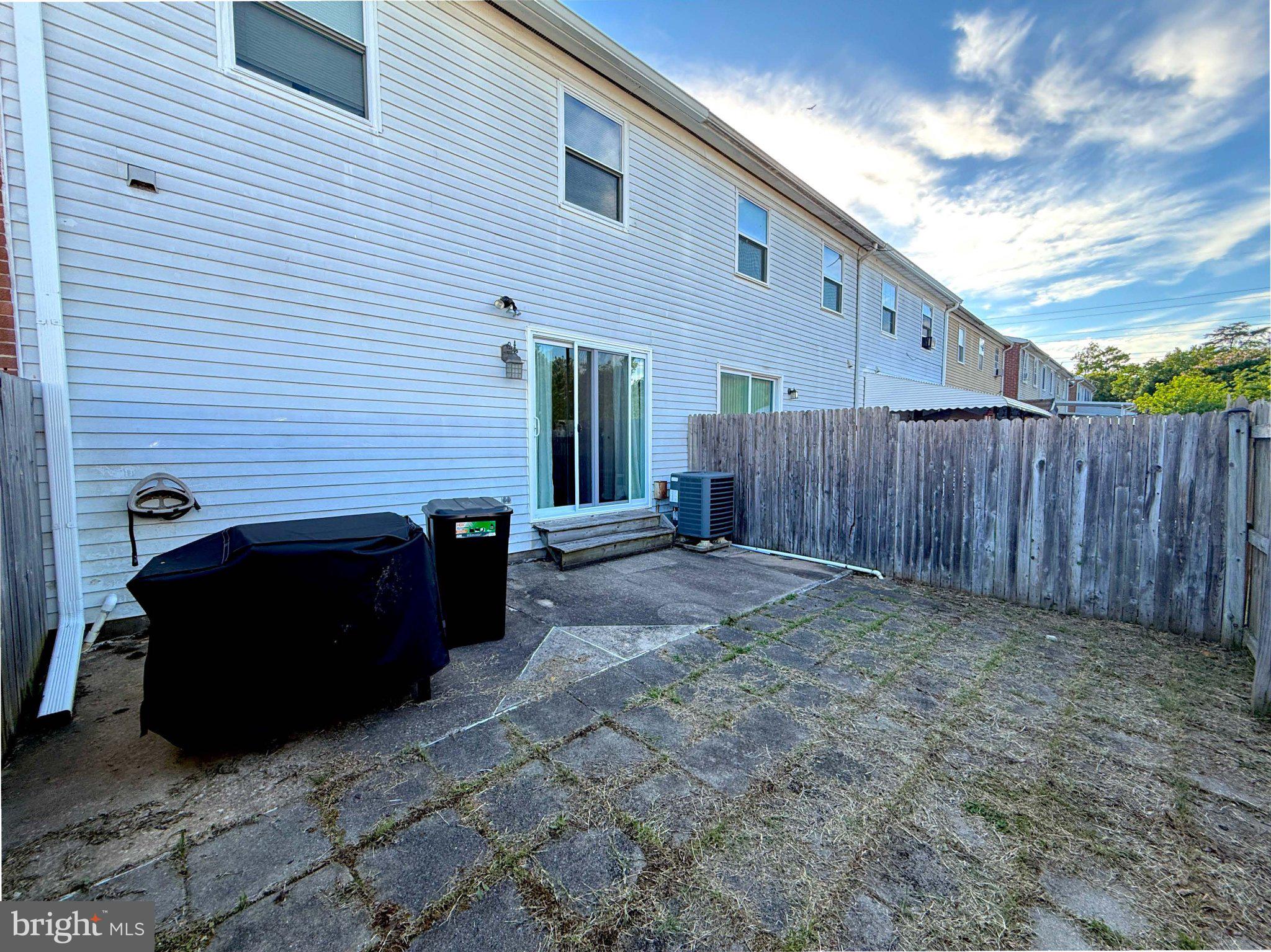 813 Thimbleberry Road, Unit 813 Baltimore, MD 21220 - Photo 26 of 32 Spacious backyard with potential charm.