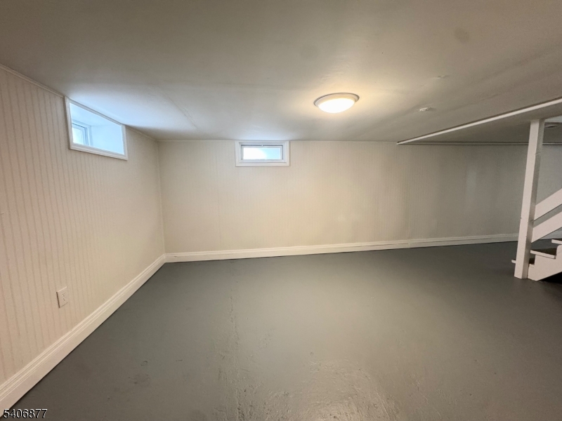 156 East Prospect Street, Unit 1 Hackettstown, NJ 07840 - Photo 16 of 21 an empty room with a empty space and windows