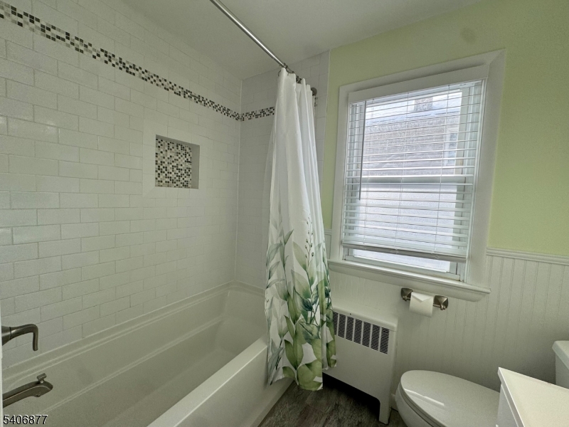 156 East Prospect Street, Unit 1 Hackettstown, NJ 07840 - Photo 9 of 21 a bathroom with a toilet and a bathtub