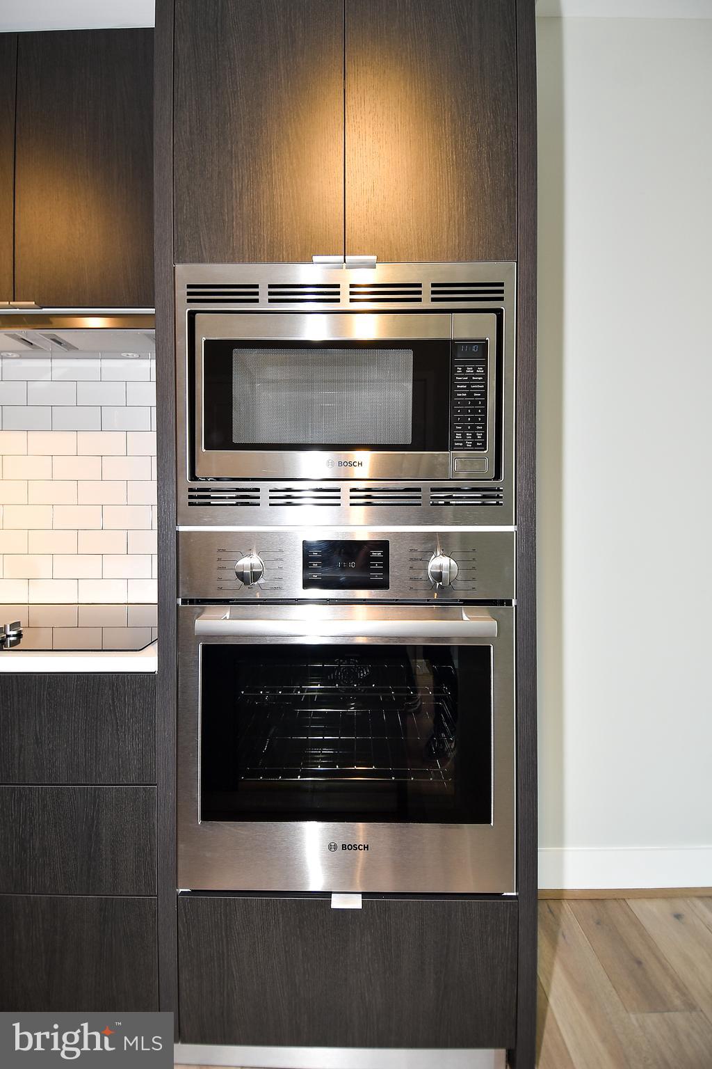 1300 4th Street Southeast, Unit 413 Washington, DC 20003 - Photo 11 of 47 a stove top oven sitting inside of a kitchen