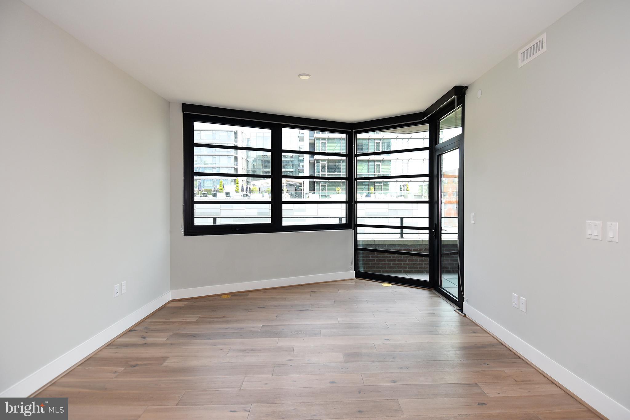 1300 4th Street Southeast, Unit 413 Washington, DC 20003 - Photo 12 of 47 a view of an empty room with a window