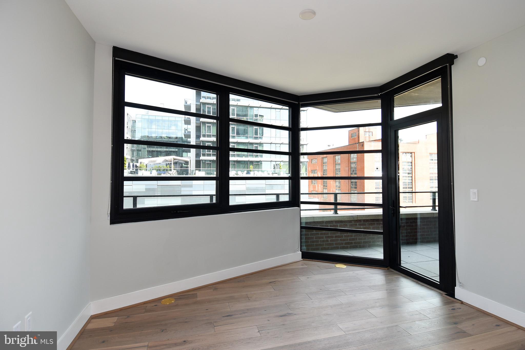 1300 4th Street Southeast, Unit 413 Washington, DC 20003 - Photo 13 of 47 wooden floor in an empty room