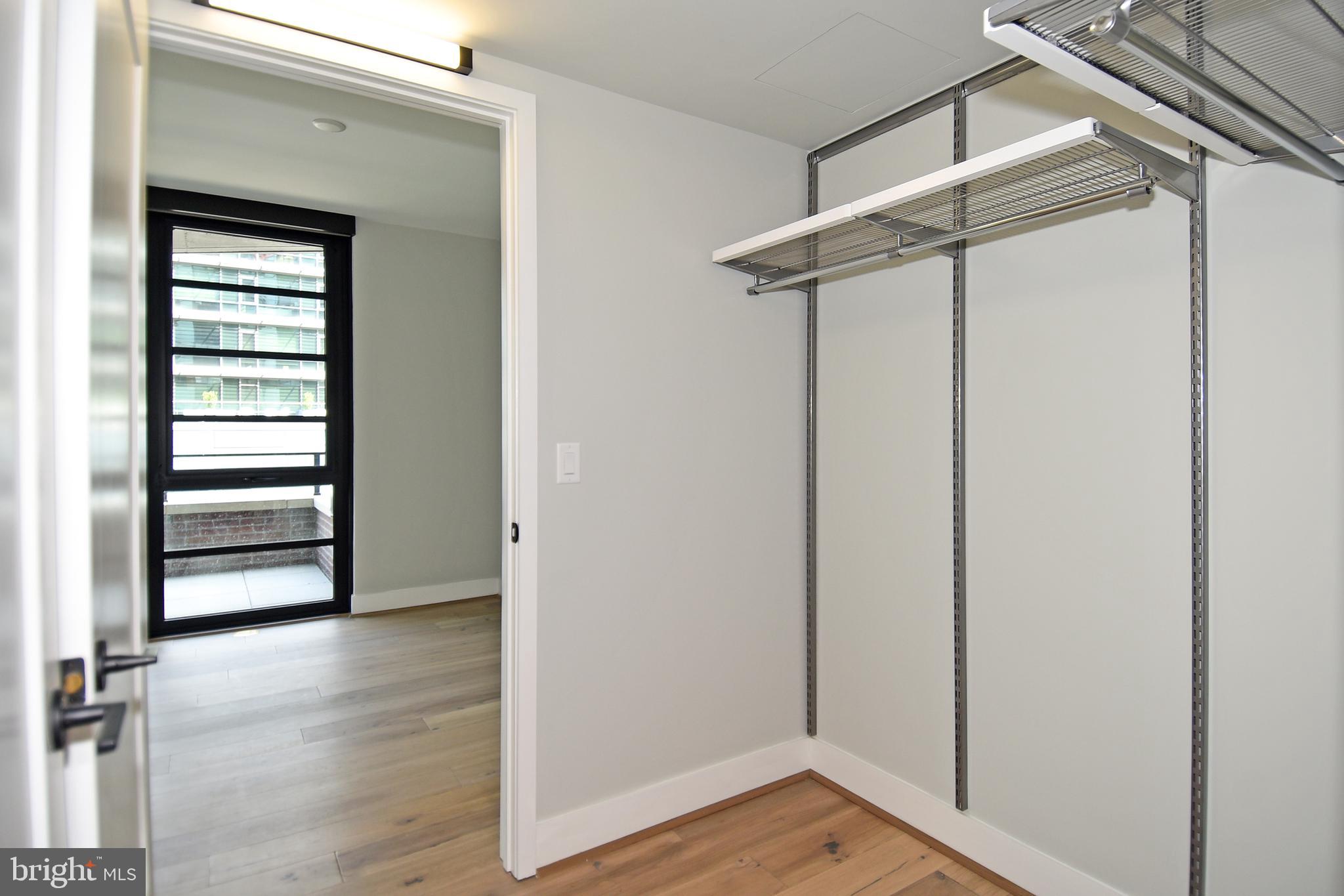 1300 4th Street Southeast, Unit 413 Washington, DC 20003 - Photo 19 of 47 a view of empty room with wooden floor and fan