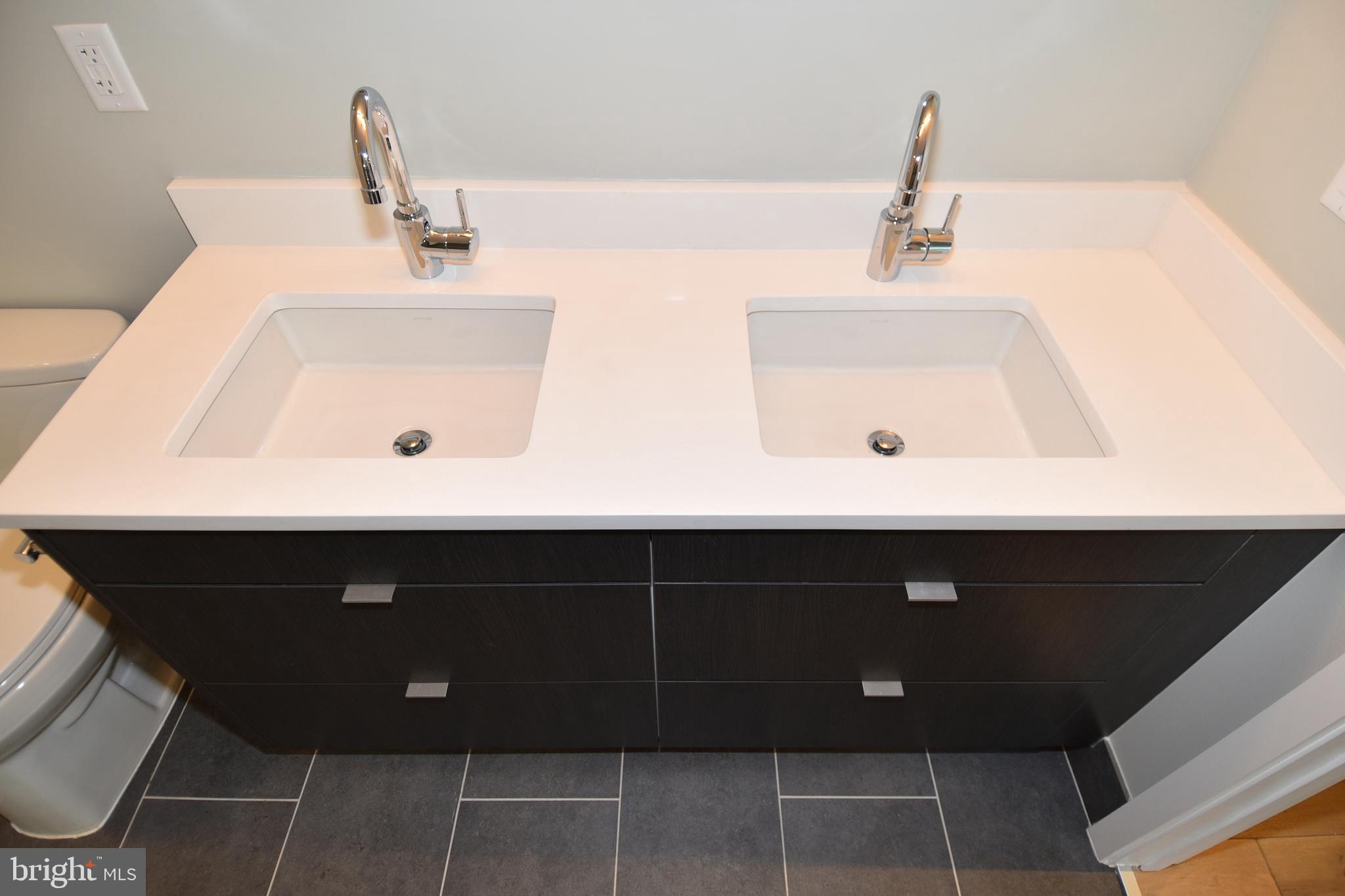 1300 4th Street Southeast, Unit 413 Washington, DC 20003 - Photo 23 of 47 a bathroom with a sink and a mirror