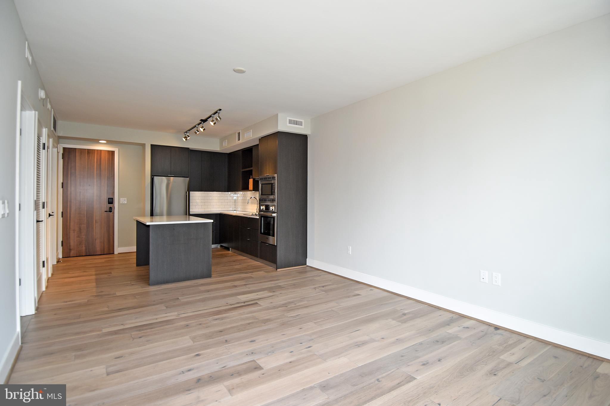 1300 4th Street Southeast, Unit 413 Washington, DC 20003 - Photo 25 of 47 a view of kitchen and wooden floor