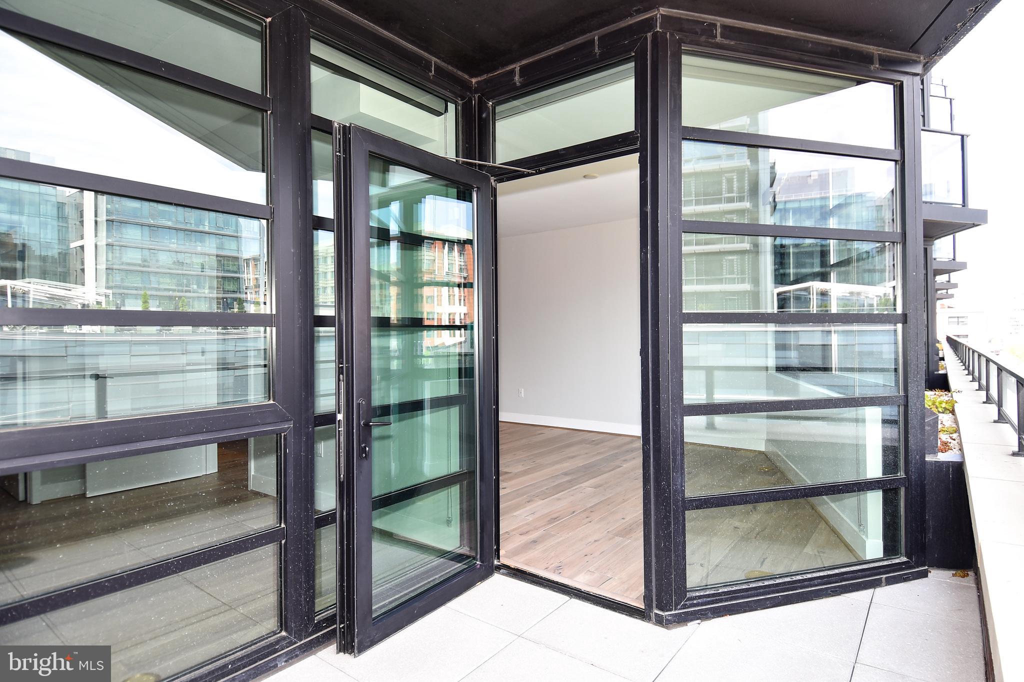1300 4th Street Southeast, Unit 413 Washington, DC 20003 - Photo 28 of 47 a view of a glass door with a glass door