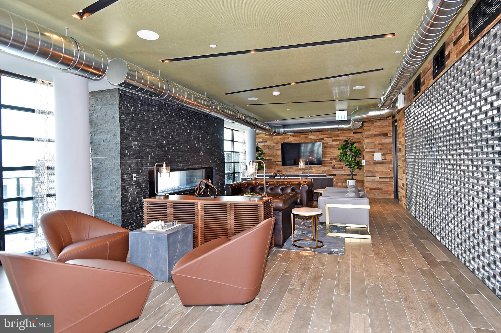 1300 4th Street Southeast, Unit 413 Washington, DC 20003 - Photo 33 of 47 a living room with furniture and a wooden floor