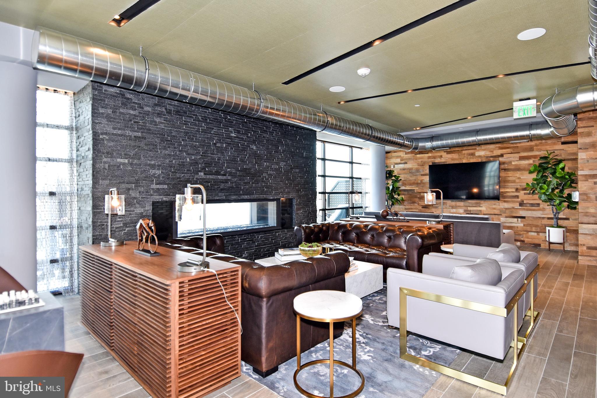 1300 4th Street Southeast, Unit 413 Washington, DC 20003 - Photo 34 of 47 a living room with furniture and a flat screen tv