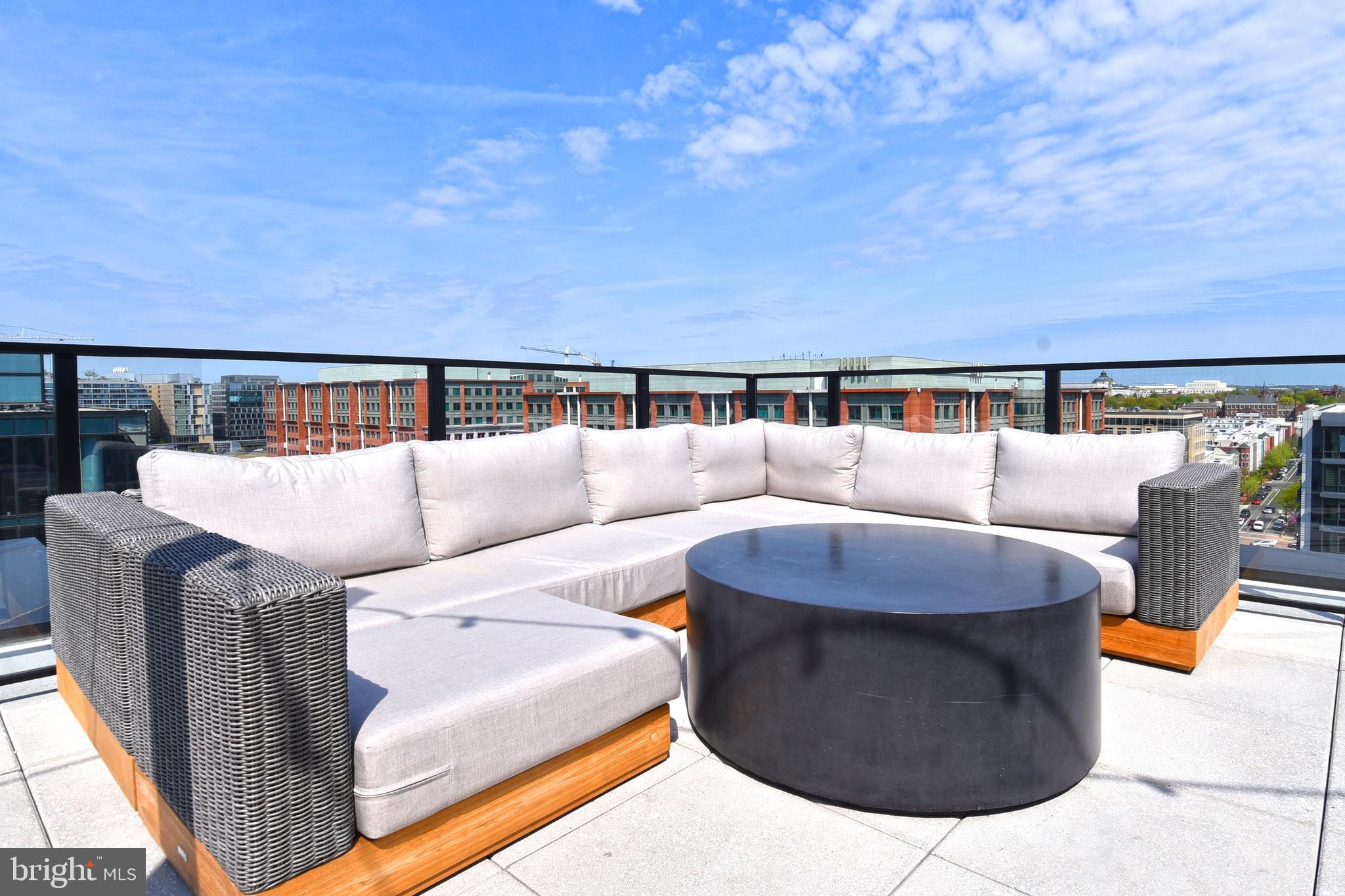 1300 4th Street Southeast, Unit 413 Washington, DC 20003 - Photo 36 of 47 a balcony with furniture and city view