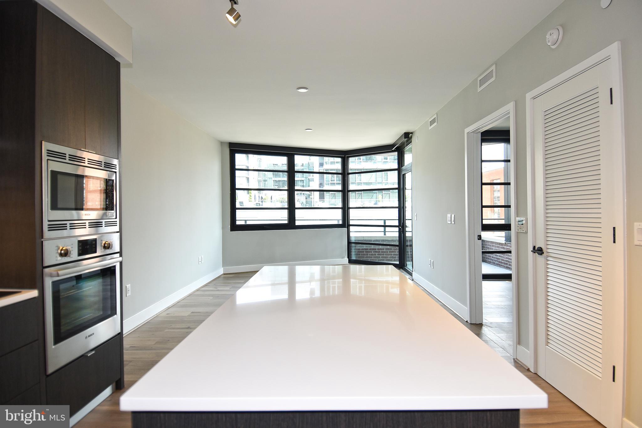 1300 4th Street Southeast, Unit 413 Washington, DC 20003 - Photo 7 of 47 a view of a living room with windows