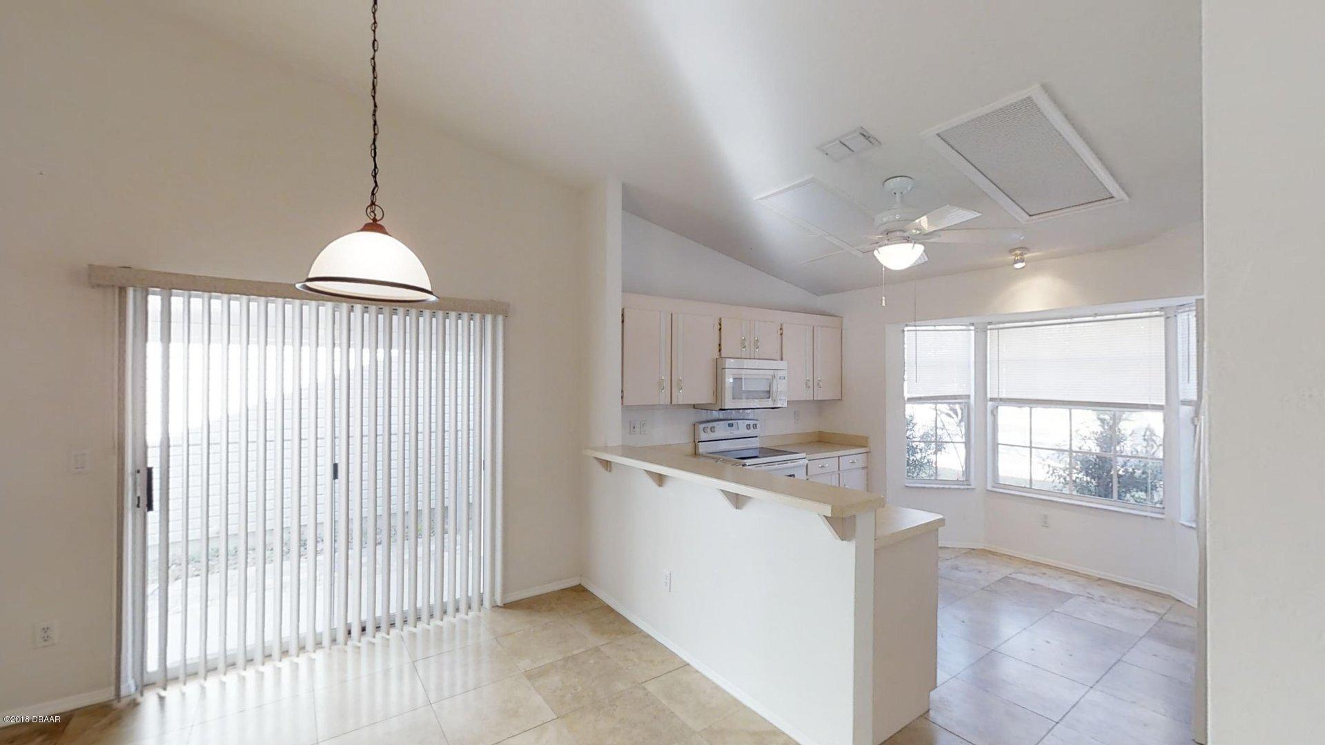 1034 Deer Springs Road Port Orange, FL 32129 - Photo 3 of 21 Kitchen/Dining