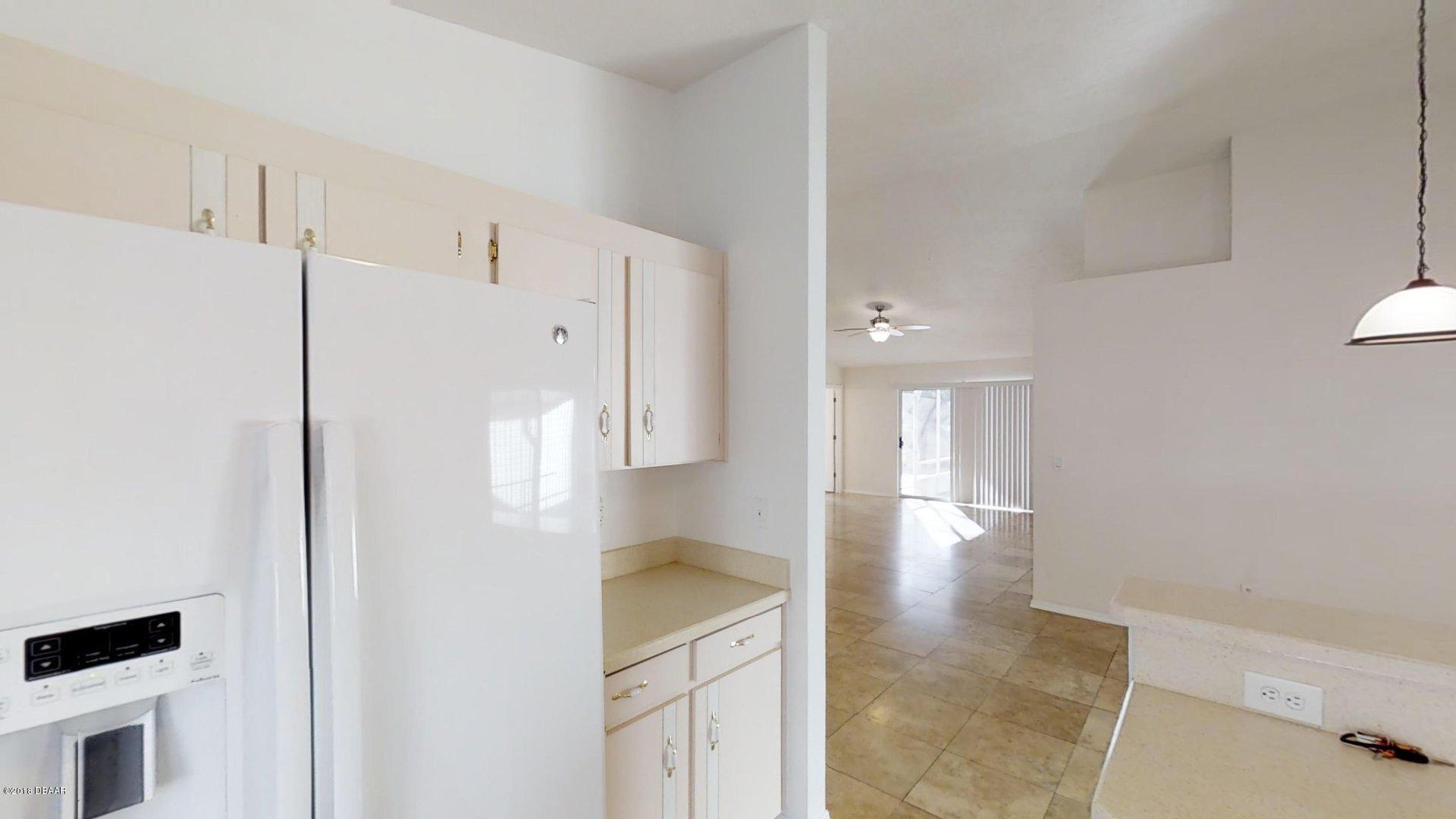 1034 Deer Springs Road Port Orange, FL 32129 - Photo 6 of 21 Kitchen/Living View