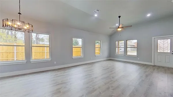 a open kitchen with window and stainless steel appliances