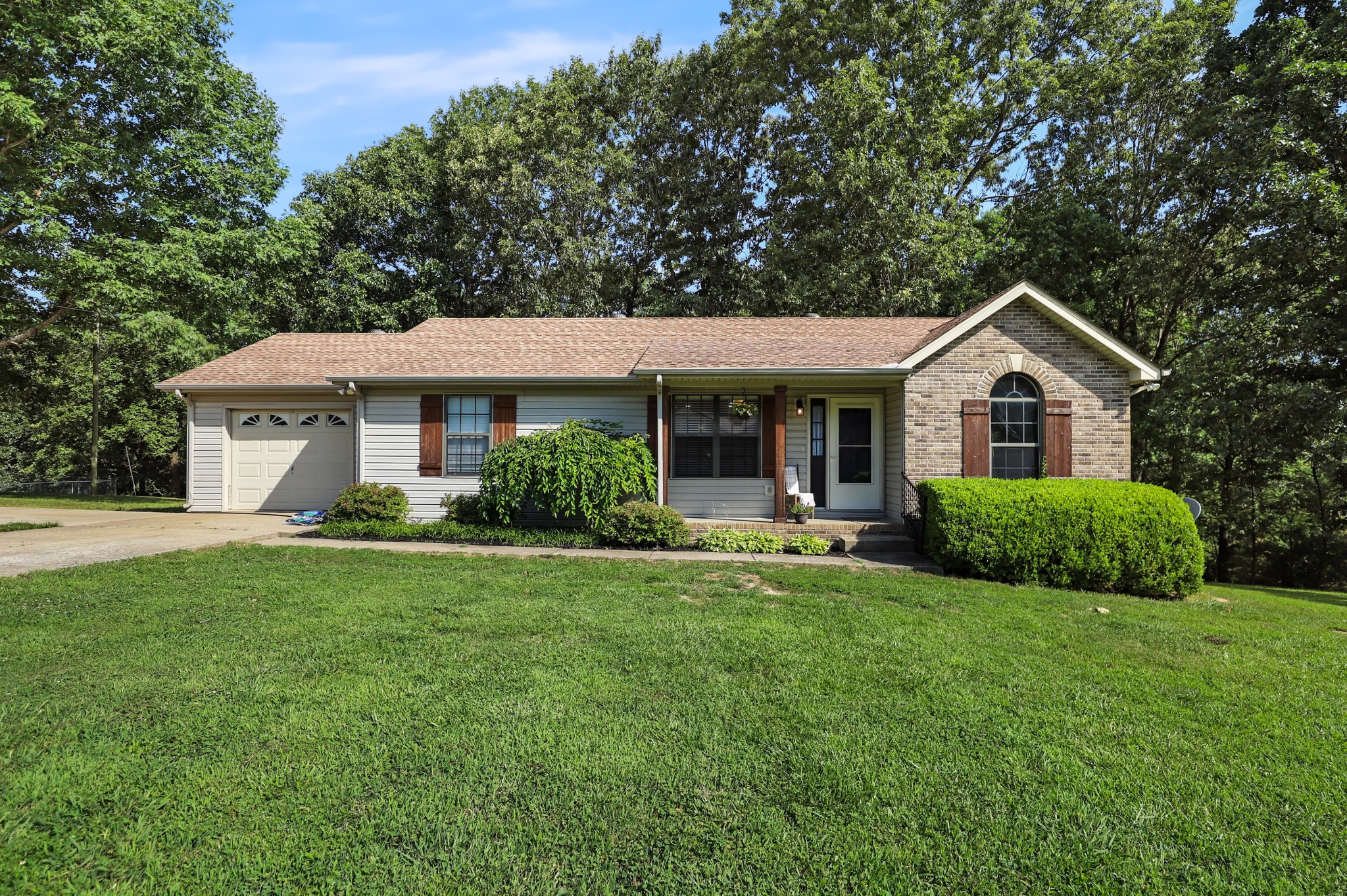 125 Oak Crest Drive Tennessee Ridge, TN 37178 - Photo 1 of 31 a front view of a house with a yard