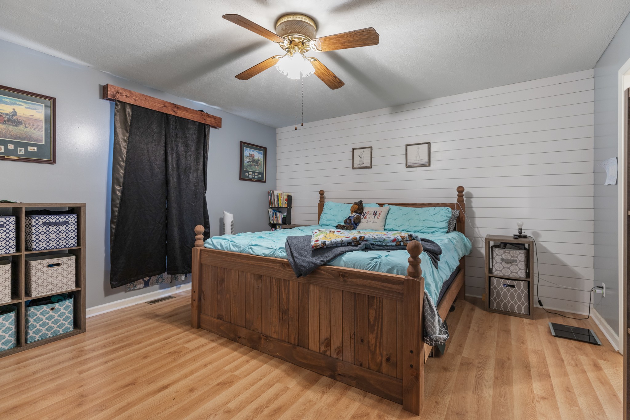 125 Oak Crest Drive Tennessee Ridge, TN 37178 - Photo 18 of 31 a bedroom with a bed and a chandelier