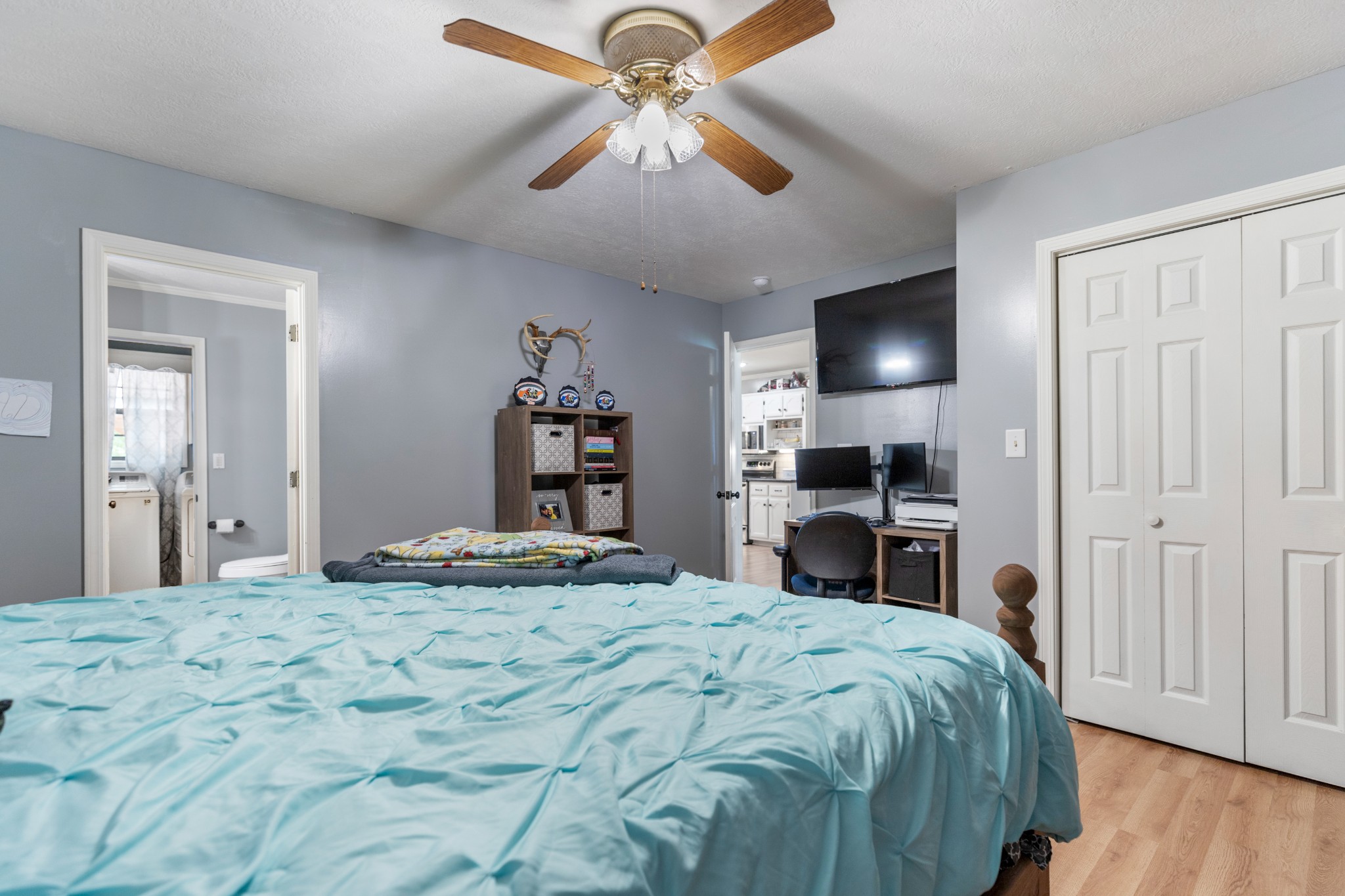 125 Oak Crest Drive Tennessee Ridge, TN 37178 - Photo 19 of 31 a bedroom with a bed and a chandelier
