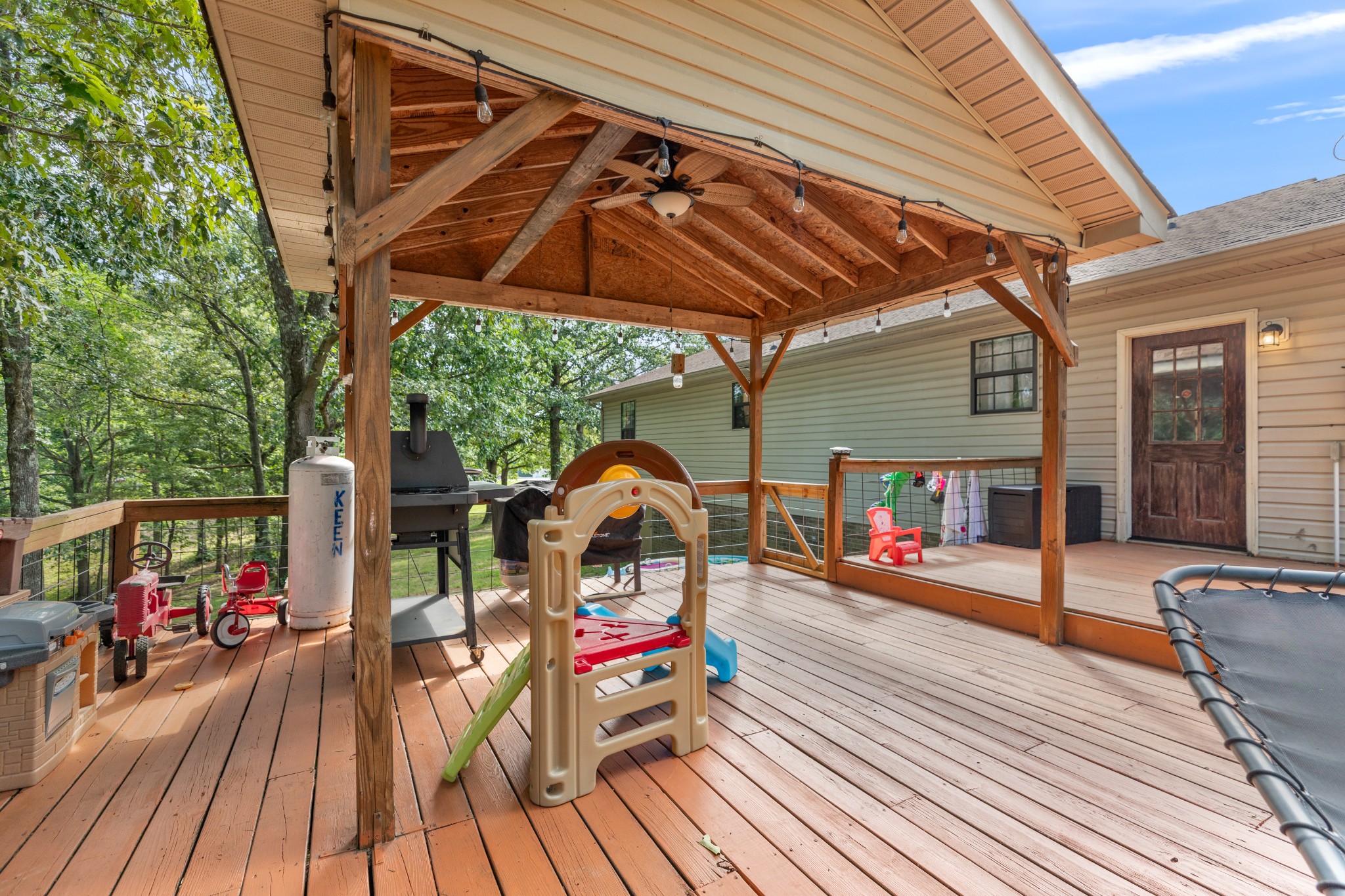 125 Oak Crest Drive Tennessee Ridge, TN 37178 - Photo 24 of 31 a view of a couches on the deck in front of house