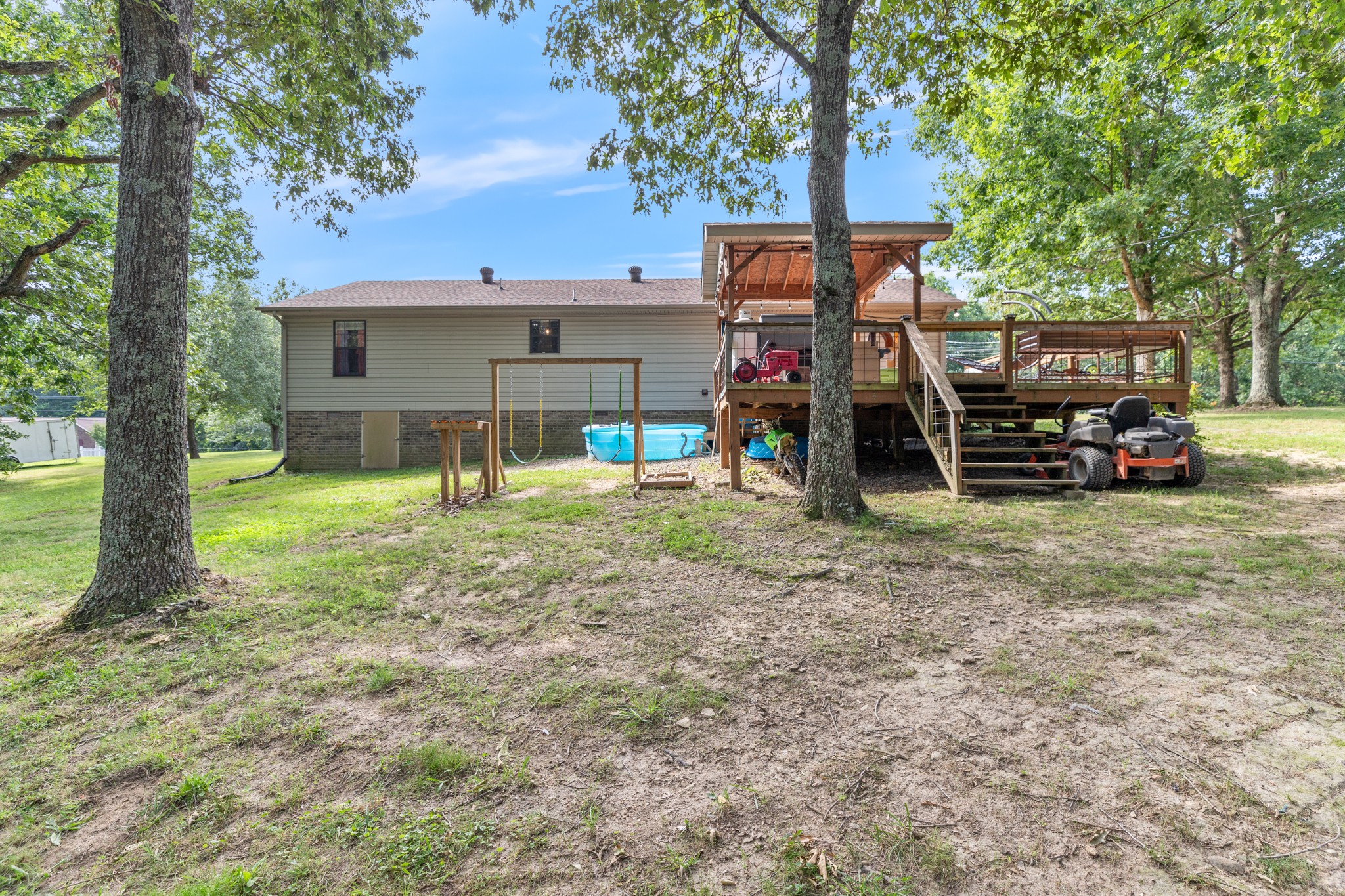 125 Oak Crest Drive Tennessee Ridge, TN 37178 - Photo 27 of 31 a view of a house with a backyard and a tree