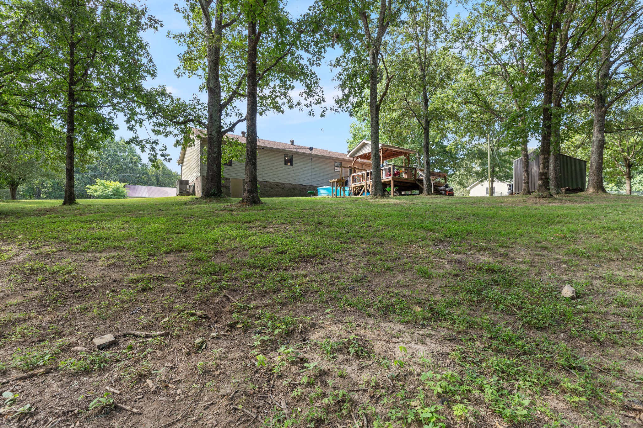 125 Oak Crest Drive Tennessee Ridge, TN 37178 - Photo 29 of 31 a big yard with lots of green space and tree